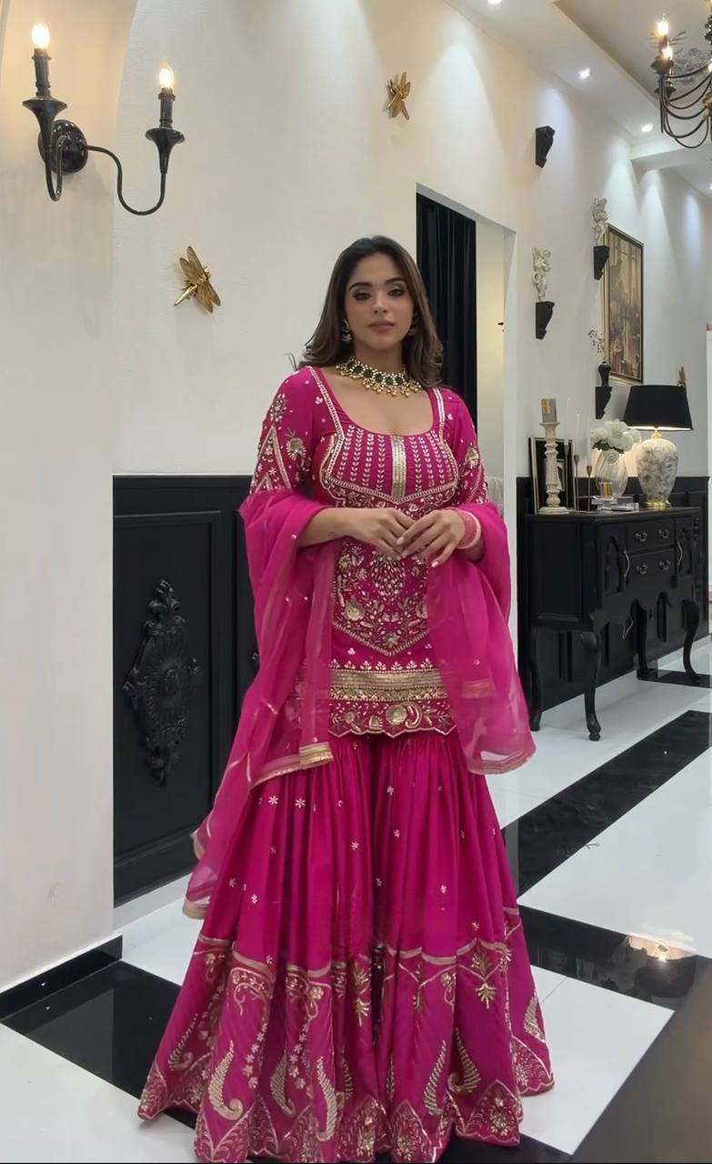 Radiant Pink Attire with Luxurious Details