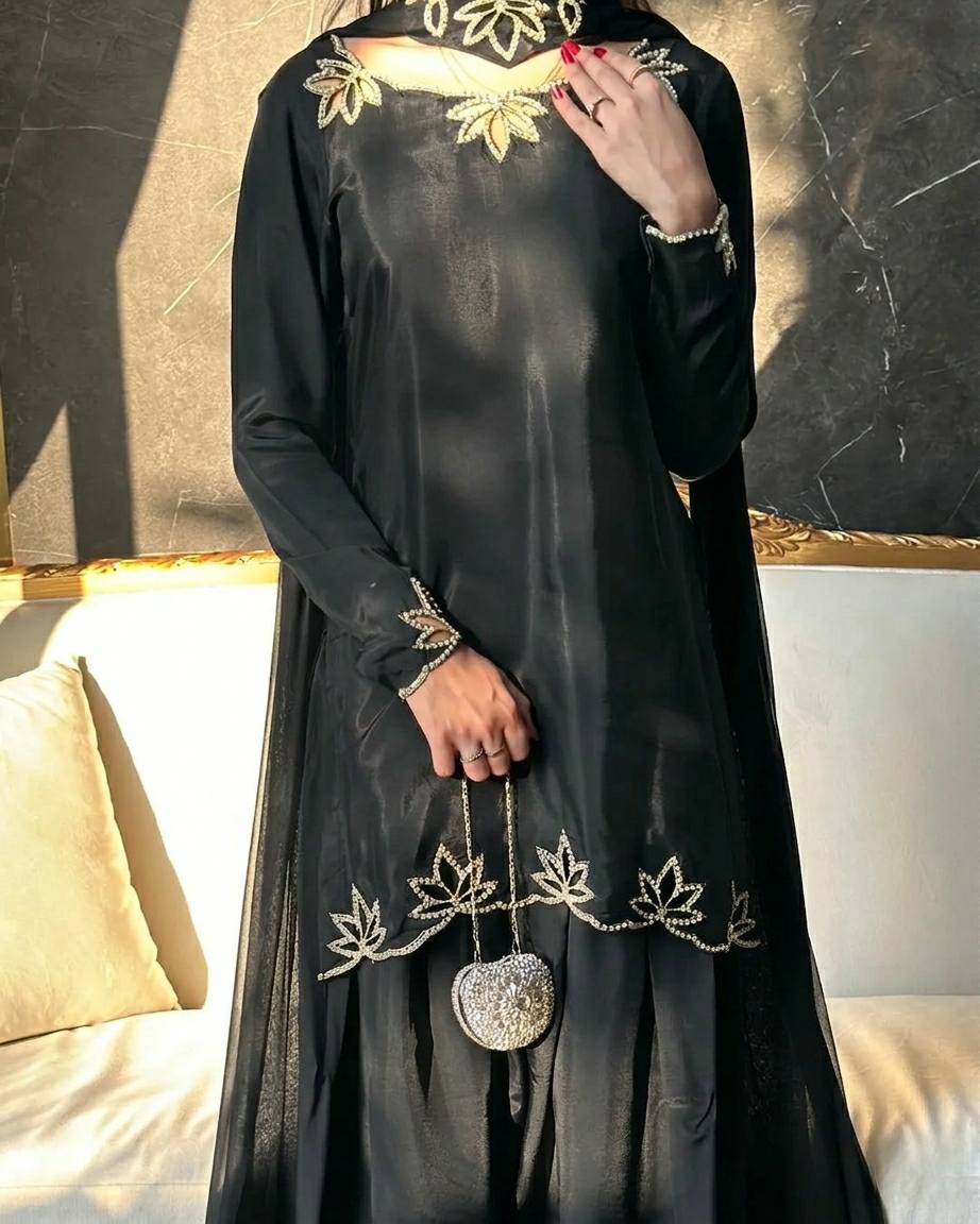 Elegant ivory salwar suit with black embroidery