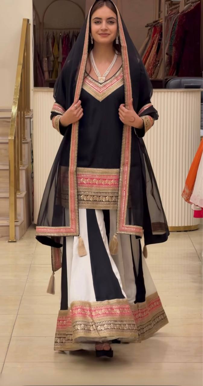 Opulent Black Ethnic Ensemble Adorned With Exquisite Golden Border Detailing