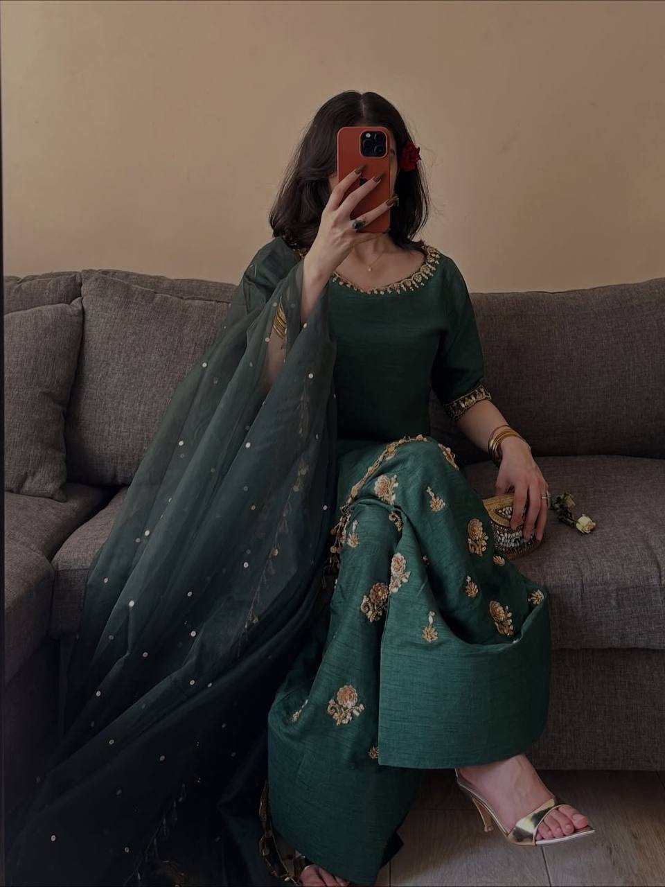 Opulent Emerald Ethnic Ensemble Adorned With Intricate Golden Tassel Accents
