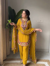 Intricately embroidered festive ethnic tunic suit set.